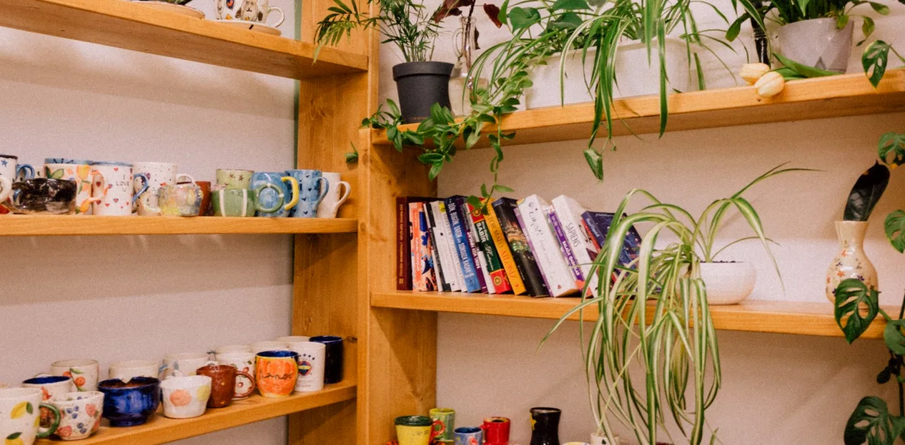 The Few Materials We Reach for When Styling a Shelf Behind a Speaker